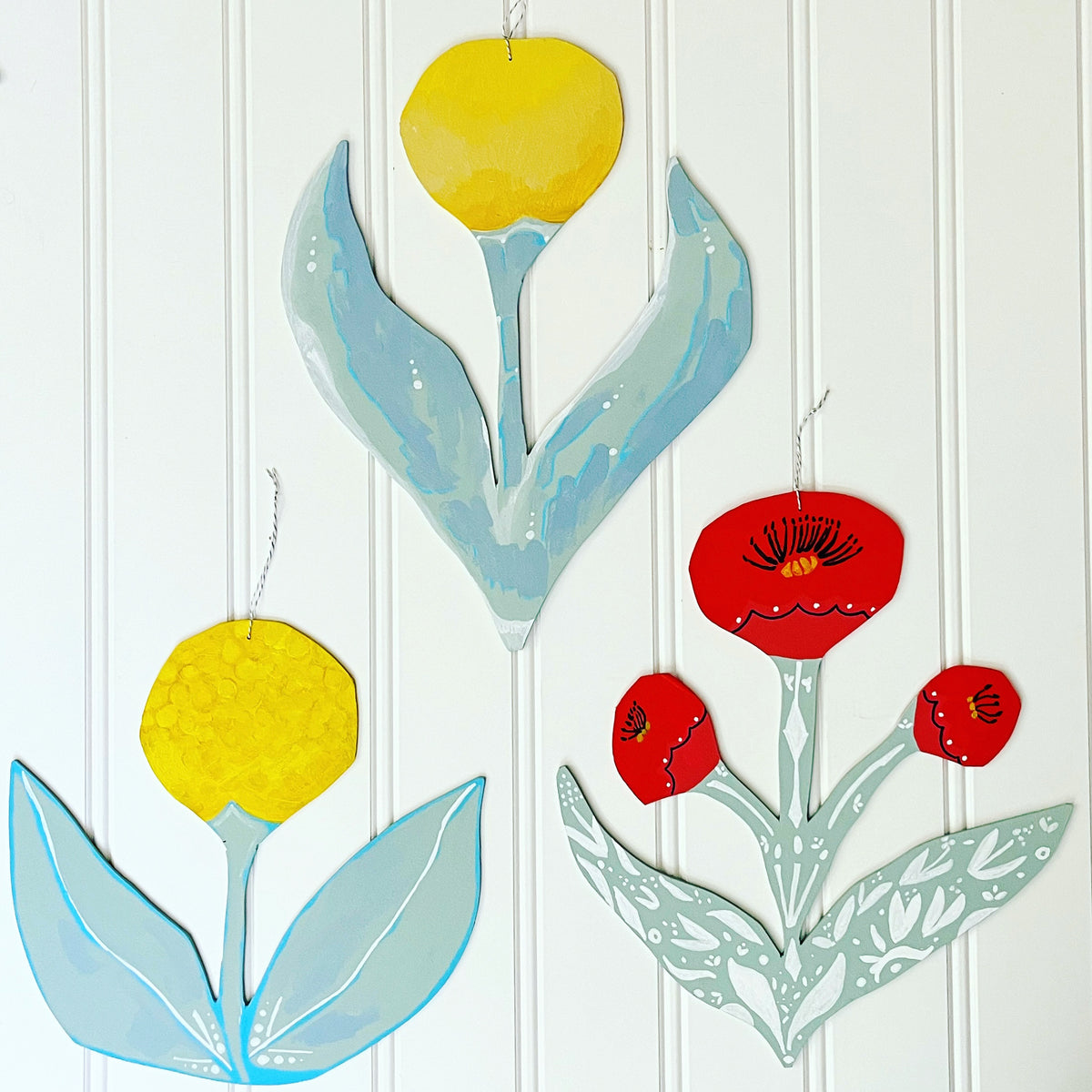 cutout wooden flower painting, by artist Abigail Gray Swartz. group of three floral paintings, acrylic on panel.