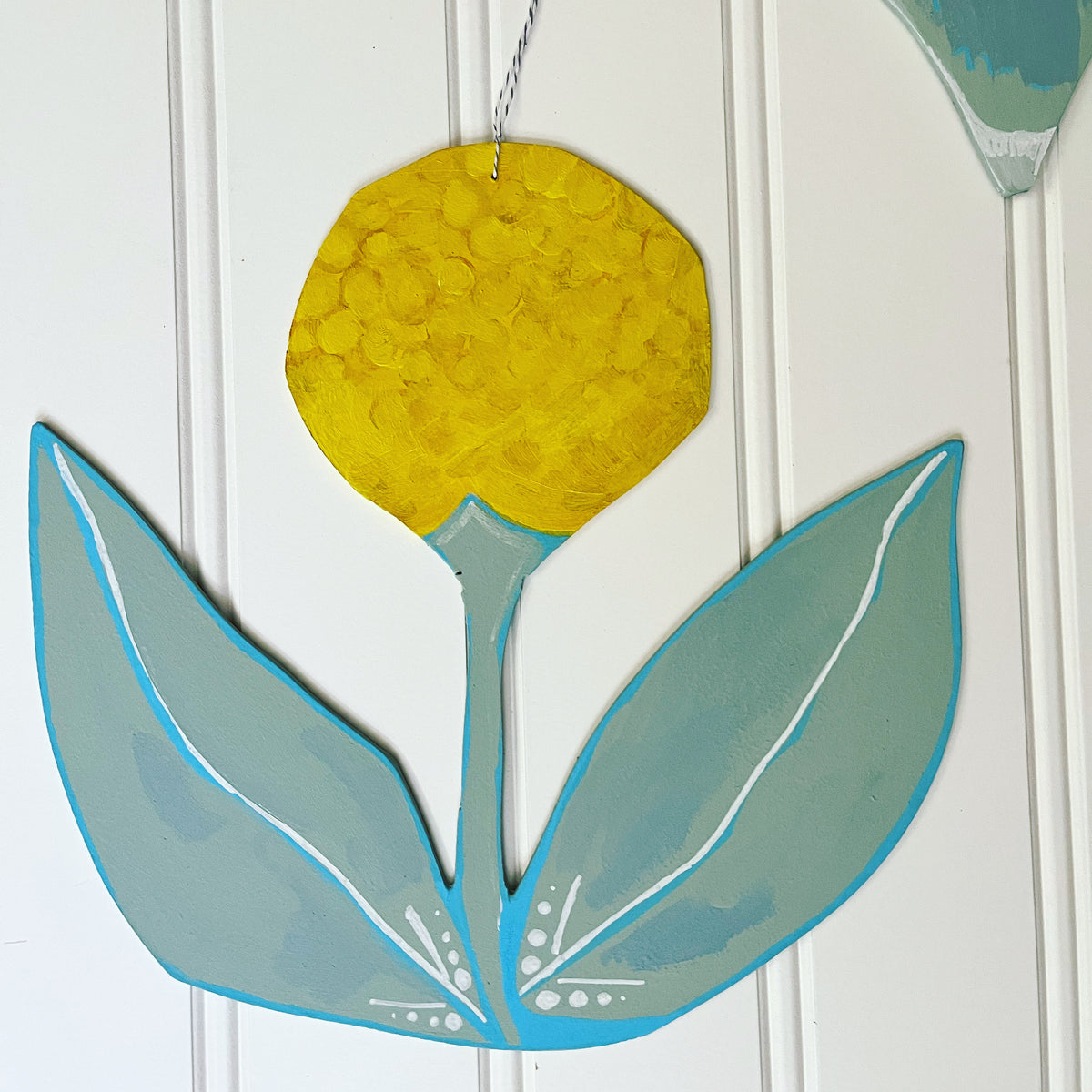 cutout wooden flower painting, by artist Abigail Gray Swartz. Small yellow flower, acrylic on panel.