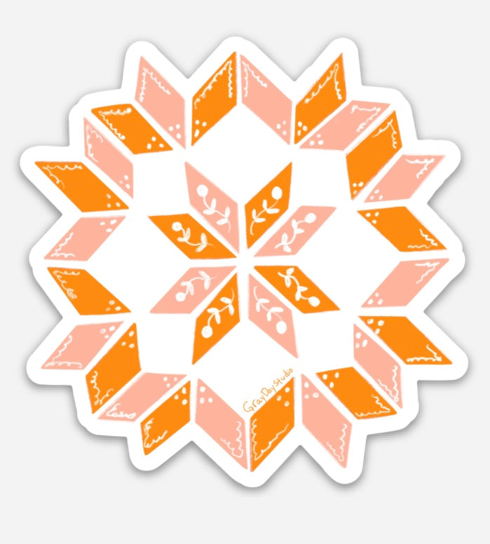 Pink and orange quilt sticker with floral detailing.