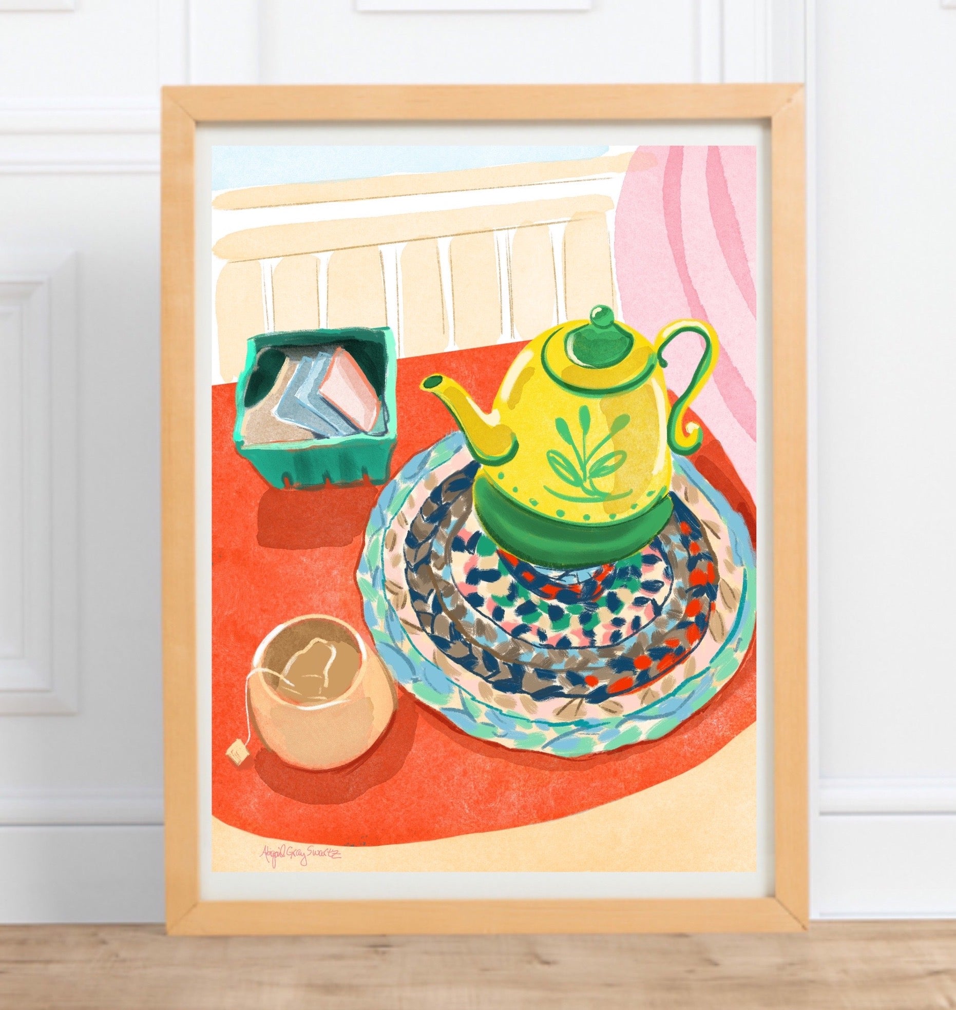 tea time art print features a tomatoe red table, with a yellow teapot, handwoven mat, tea bags and a steeping mug full of tea. colorful and vibrant art.