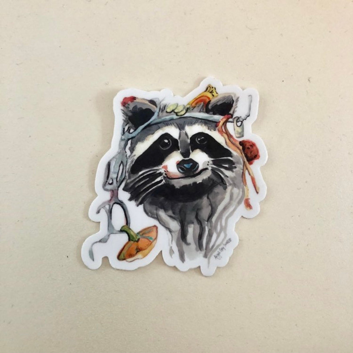 Dumpster Diver sticker of raccoon face by GrayDayStudio